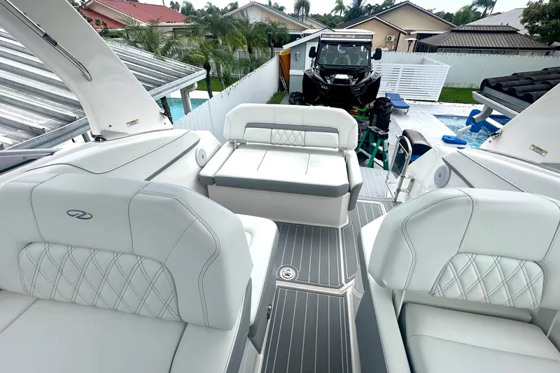 Slide: The Image of 2025 Regal 26 XO boat interior with white seating and modern design. - 28