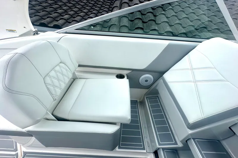Slide: The Image of 2025 Regal 26 XO boat interior with white leather seating and modern design. - 30