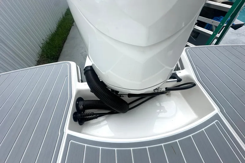 Slide: The Image of 2025 Regal 26 XO boat engine area with sleek design and modern fittings. - 53