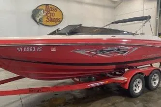 Slide: The Image of Red 2008 Regal 2000 Bowrider boat on trailer at Bass Pro Shops. - 1