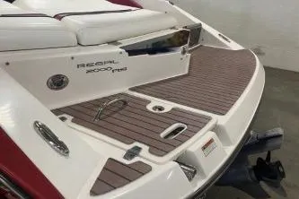 Slide: The Image of 2008 Regal 2000 Bowrider boat with teak swim platform and white seating. - 2