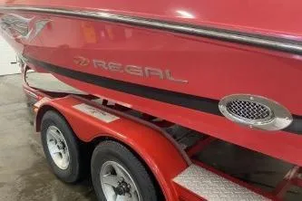 Slide: The Image of Red 2008 Regal 2000 Bowrider boat on a trailer, side view. - 4