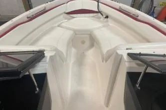 Slide: The Image of 2008 Regal 2000 Bowrider boat interior with white seating and open windshield. - 7