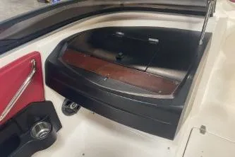 Slide: The Image of 2008 Regal 2000 Bowrider interior detail with storage compartment and red accents. - 9