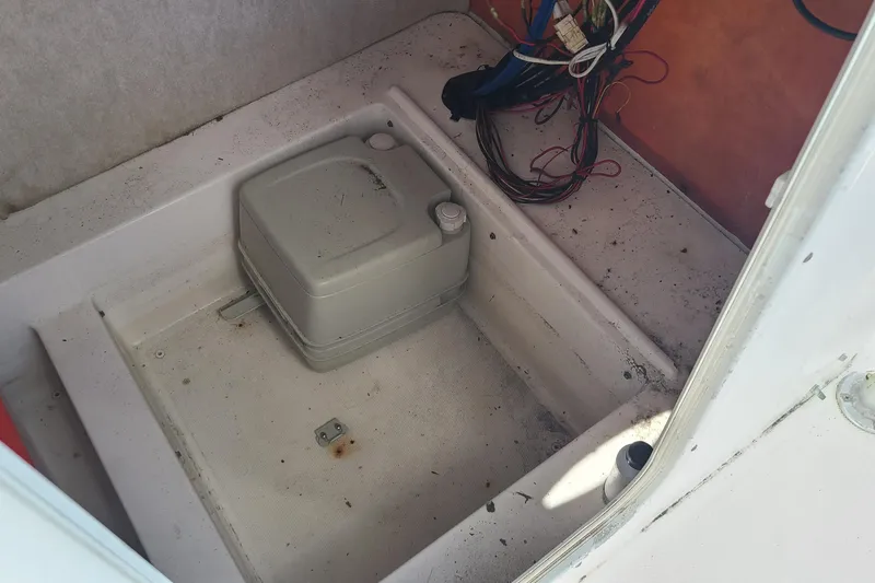 Slide: The Image of 2006 Sea Fox 287 Center Console boat interior with wiring and storage compartment. - 12