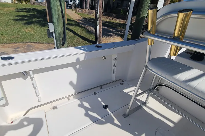 Slide: The Image of 2006 Sea Fox 287 Center Console interior with seating and rod holders. - 14
