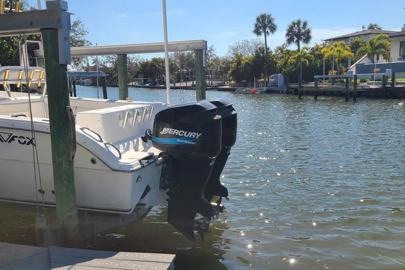 Slide: The Image of 2006 Sea Fox 287 Center Console boat with Mercury outboard motor docked by waterfront. - 19