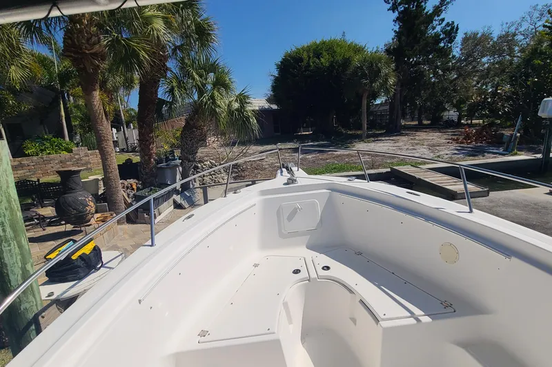 Slide: The Image of 2006 Sea Fox 287 Center Console boat docked near palm trees. - 4