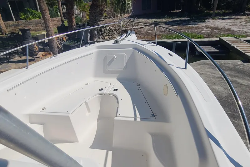 Slide: The Image of 2006 Sea Fox 287 Center Console boat with spacious deck and seating area. - 5