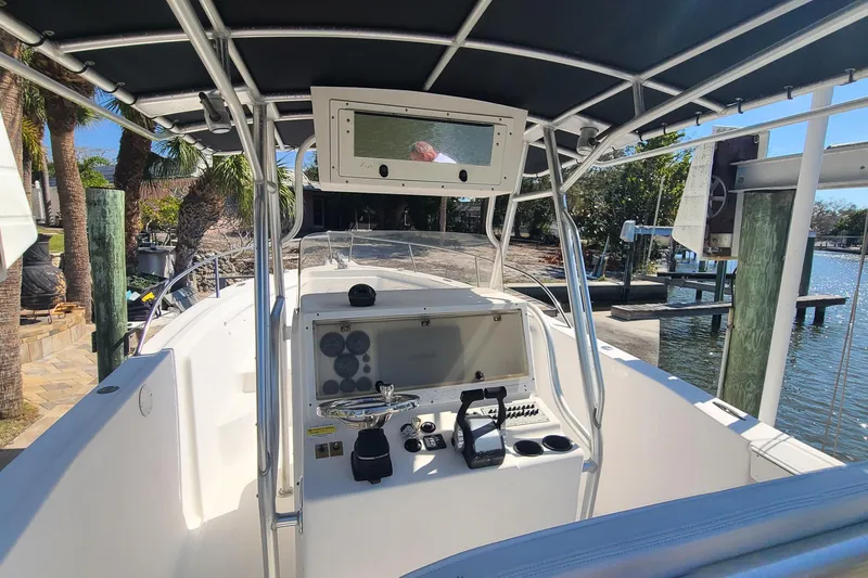 Slide: The Image of 2006 Sea Fox 287 Center Console boat interior with navigation equipment and waterfront view. - 6