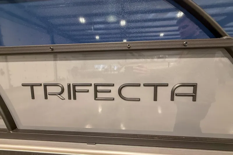 Slide: The Image of 2025 Trifecta 22UL CS boat logo on metallic surface. - 11
