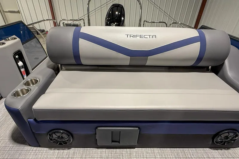 Slide: The Image of 2025 Trifecta 22UL CS boat interior with cushioned seating and cup holders. - 2