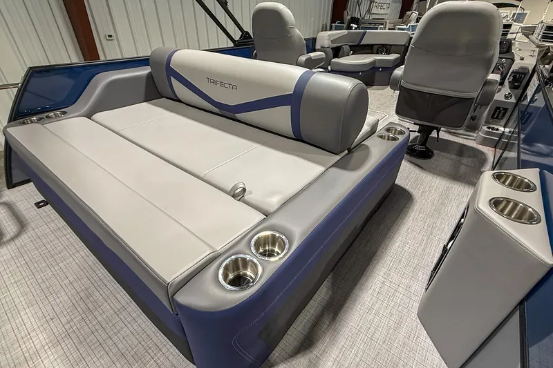 Slide: The Image of 2025 Trifecta 22UL CS pontoon boat interior with plush seating and cup holders. - 3
