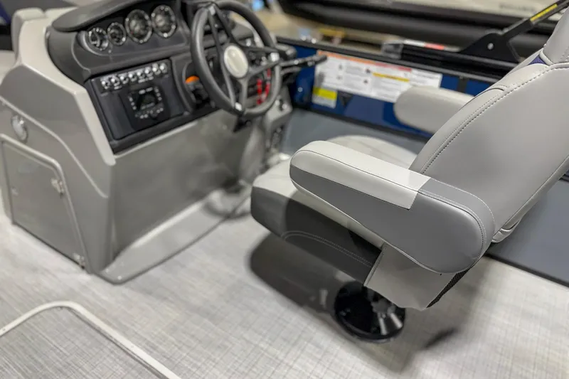 Slide: The Image of 2025 Trifecta 22UL CS boat interior with steering console and captain's chair. - 4