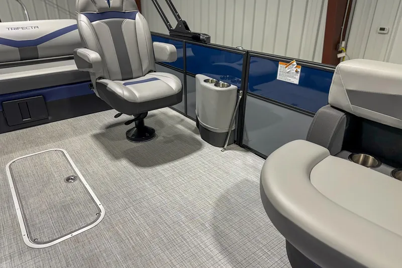 Slide: The Image of 2025 Trifecta 22UL CS boat interior with gray seating and modern design. - 5