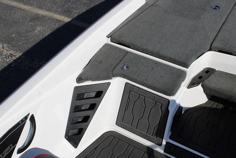 Slide: The Image of 2022 Skeeter ZXR21 boat deck with textured flooring and storage compartments. - 19