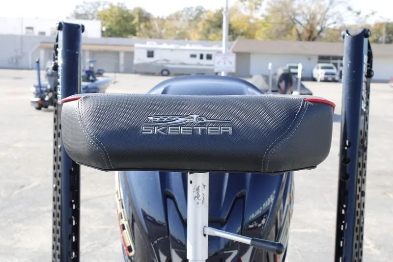 Slide: The Image of 2022 Skeeter ZXR21 boat seat with logo, outdoor setting. - 22