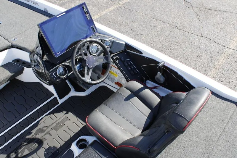 Slide: The Image of 2022 Skeeter ZXR21 boat cockpit with steering wheel and control panel. - 24
