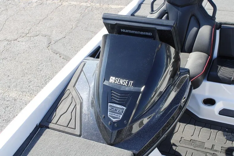 Slide: The Image of 2022 Skeeter ZXR21 boat dashboard with Humminbird electronics and sleek seating. - 25