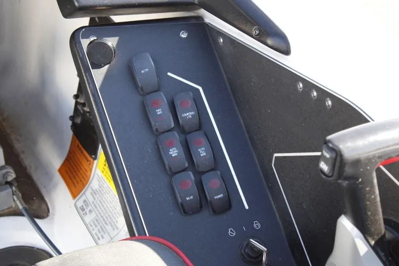 Slide: The Image of Control panel of 2022 Skeeter ZXR21 boat with labeled switches and buttons. - 27
