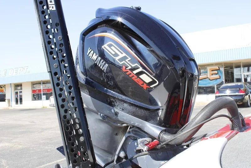 Slide: The Image of 2022 Skeeter ZXR21 with Yamaha VMAX SHO outboard motor in a parking lot. - 6