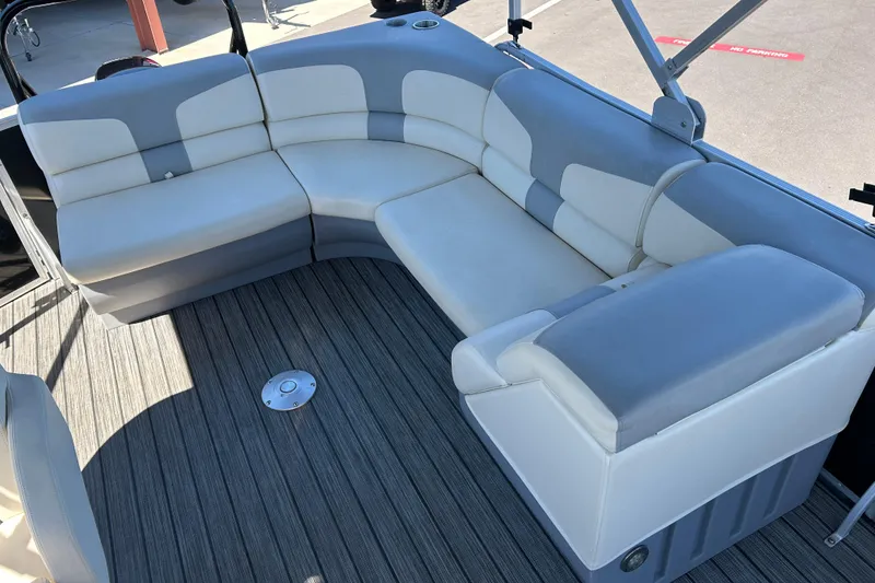 Slide: The Image of Luxurious seating on 2022 Lexington 317 series boat, featuring elegant gray and white upholstery. - 12