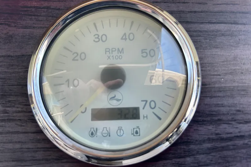 Slide: The Image of Close-up of a Lexington 317 series 2022 RPM gauge on a wooden panel. - 18