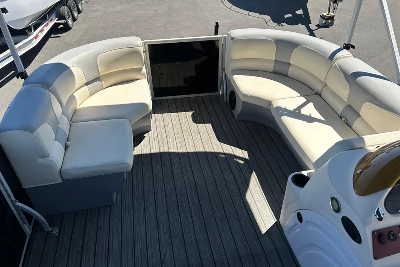Slide: The Image of Luxurious seating area on 2022 Lexington 317 series boat with elegant wood flooring. - 8