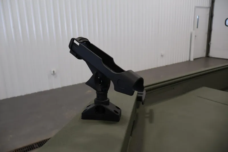 Slide: The Image of 2025 Alweld 1648 Marsh boat with mounted rod holder in a garage. - 12