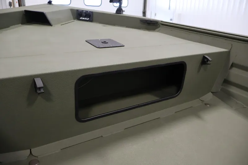 Slide: The Image of 2025 Alweld 1648 Marsh boat interior with storage compartment and control panel. - 13