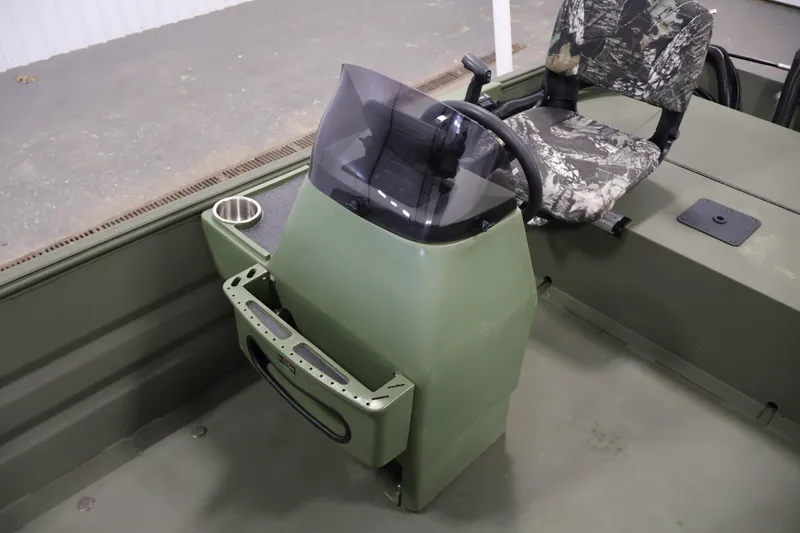 Slide: The Image of 2025 Alweld 1648 Marsh boat interior with steering console and camo seat. - 14
