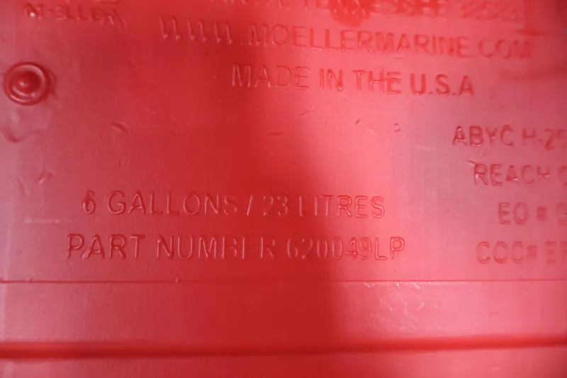 Slide: The Image of Red fuel tank with 6-gallon capacity, part number 620049LP, made in the USA. - 22