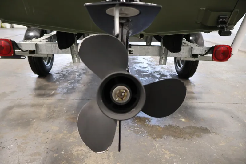 Slide: The Image of 2025 Alweld 1648 Marsh boat propeller and trailer in a garage setting. - 26