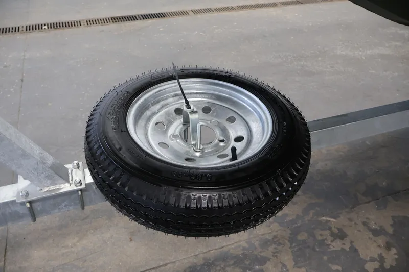 Slide: The Image of Spare tire mounted on a trailer for 2025 Alweld 1648 Marsh boat. - 28