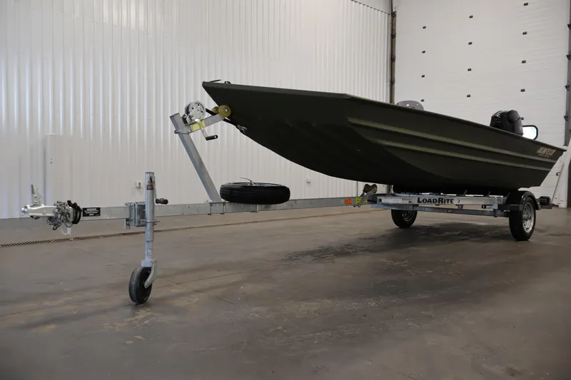 Slide: The Image of 2025 Alweld 1648 Marsh boat on Load Rite trailer in a garage setting. - 29