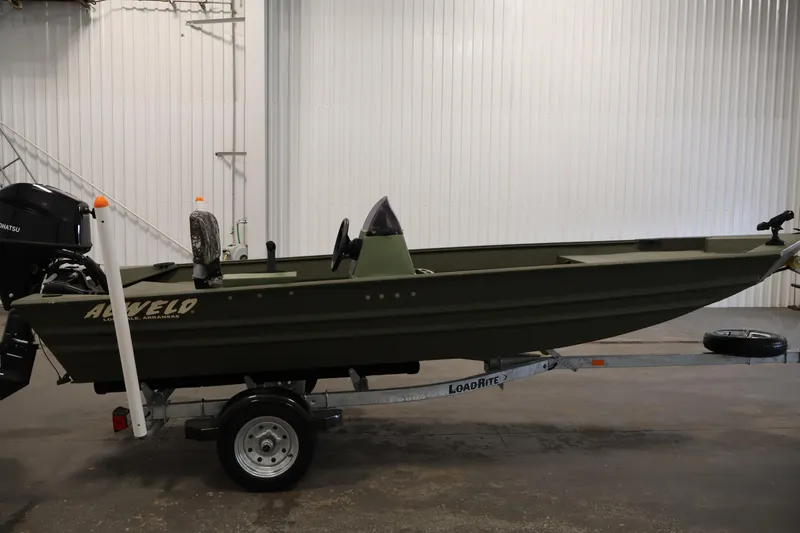 Slide: The Image of 2025 Alweld 1648 Marsh boat on Load Rite trailer in indoor setting. - 3