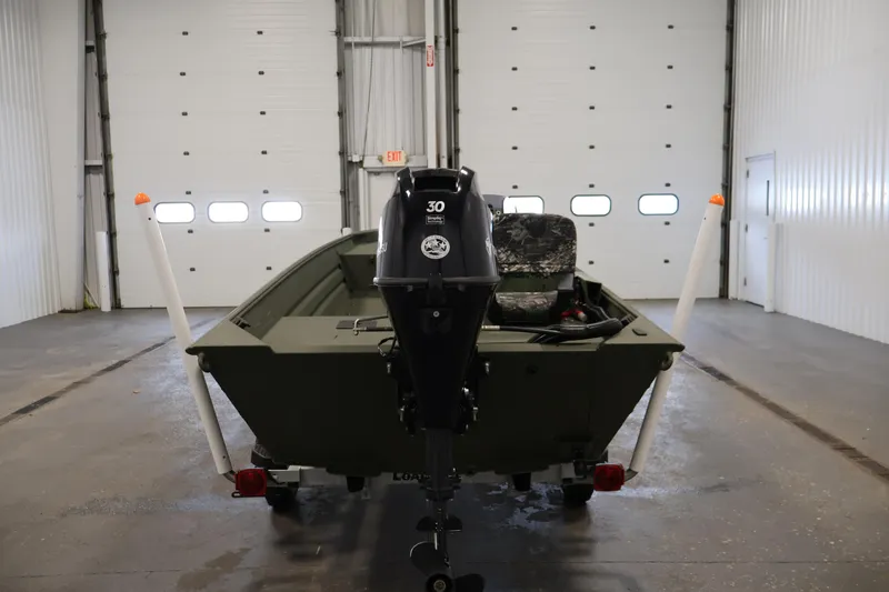 Slide: The Image of 2025 Alweld 1648 Marsh boat in garage, rear view with motor. - 5