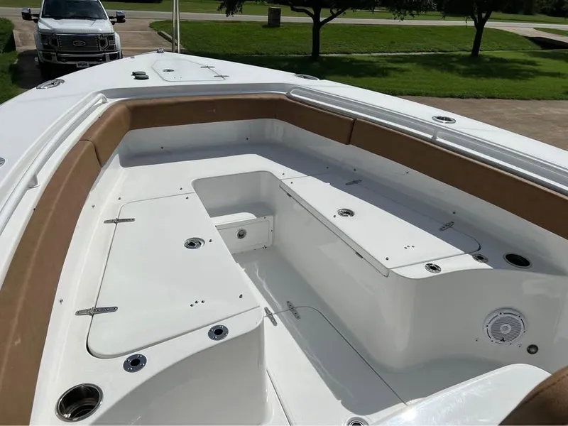 Slide: The Image of 2022 Sea Hunt Gamefish 27 boat interior with spacious seating and storage compartments. - 6