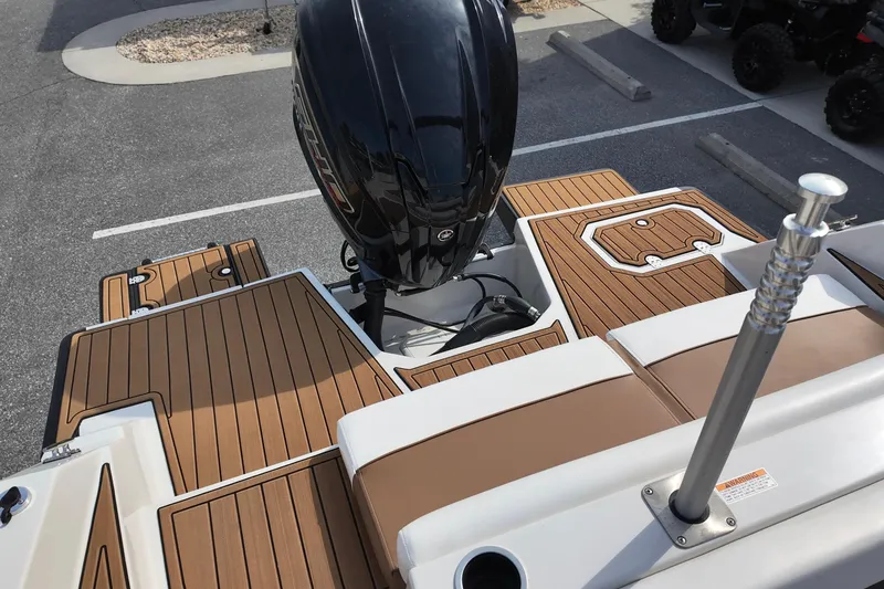 Slide: The Image of 2023 Starcraft SVX 231 OB boat with sleek deck and powerful outboard motor. - 10