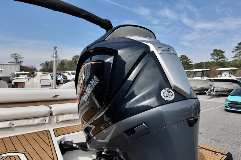 Slide: The Image of 2023 Starcraft SVX 231 OB boat with Yamaha 250 outboard motor, docked outdoors. - 15
