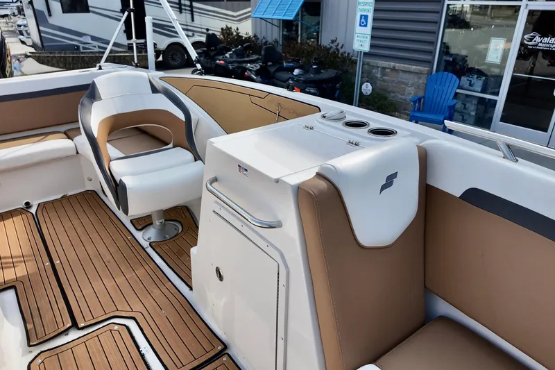 Slide: The Image of 2023 Starcraft SVX 231 OB boat interior with seating and wood flooring. - 6