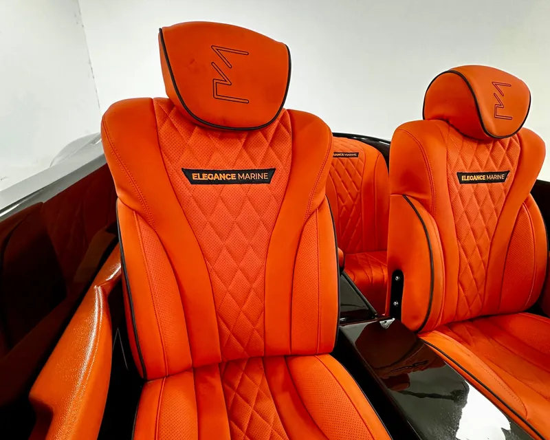 Slide: The Image of Luxurious orange seats in 2025 Fabbro Jet Car RR, featuring "Elegance Marine" branding. - 27