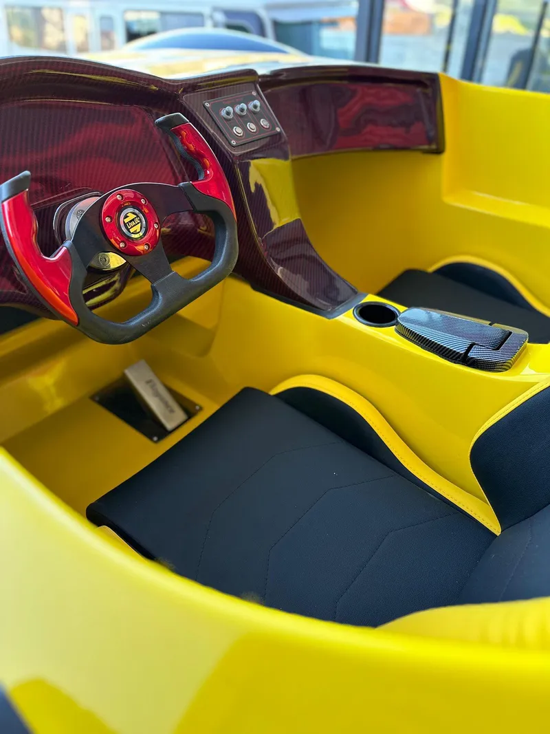 Slide: The Image of Interior of 2025 Fabbro Jet Car RR, featuring sleek yellow and black design with modern controls. - 36