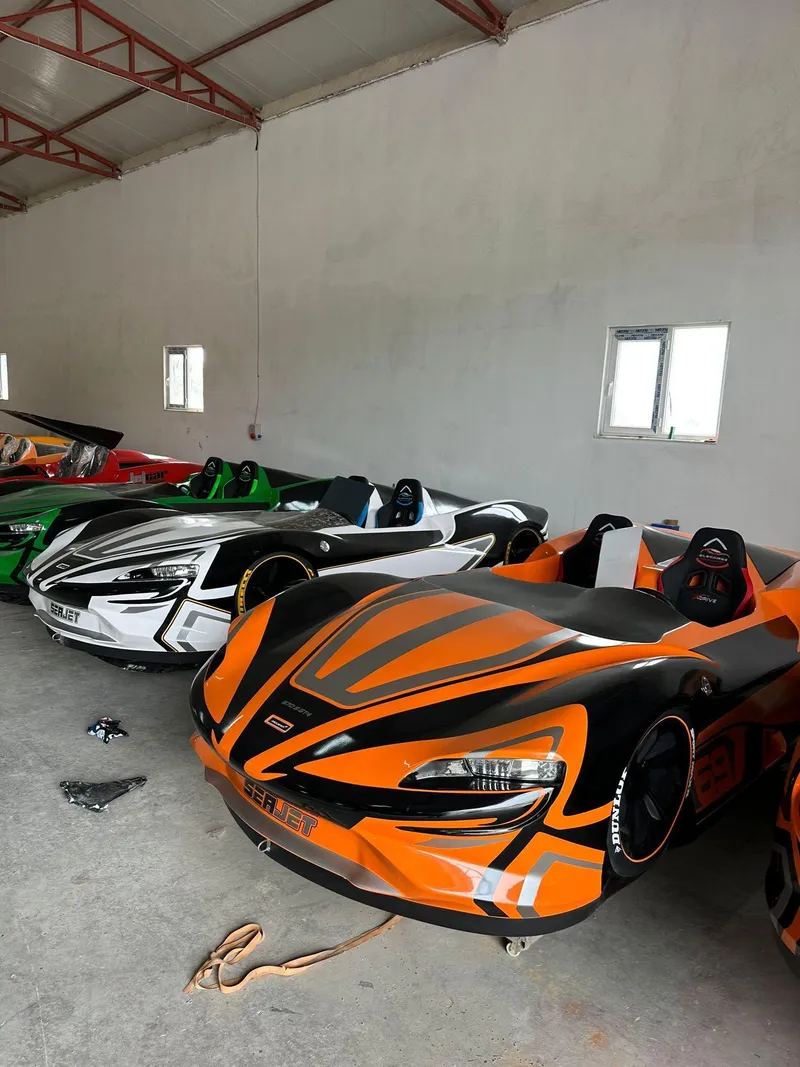 Slide: The Image of Fabbro Jet Car RR 2025 models in vibrant colors parked indoors. - 5