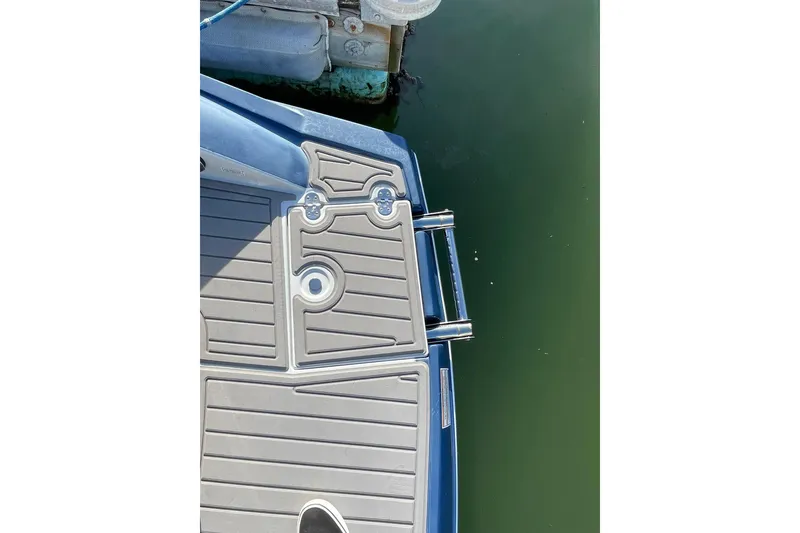 Slide: The Image of 2022 Crownline 255 SS SURF boat interior with luxurious seating and sleek design. - 10