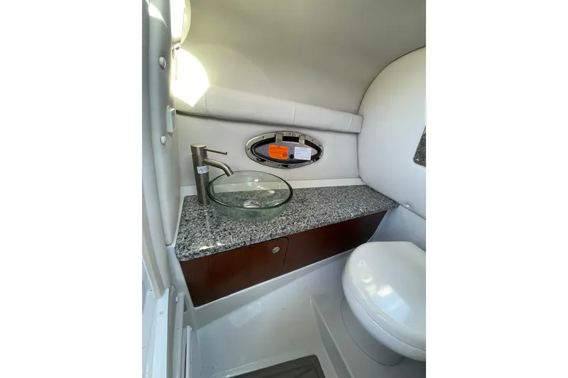 Slide: The Image of 2022 Crownline 255 SS SURF boat with speakers and sleek design. - 17