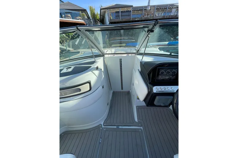 Slide: The Image of 2022 Crownline 255 SS SURF boat interior with sleek seating and modern design. - 19