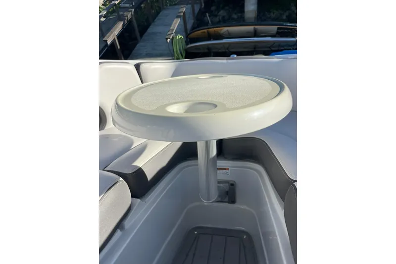 Slide: The Image of 2022 Crownline 255 SS SURF boat interior with seating and deck view. - 21