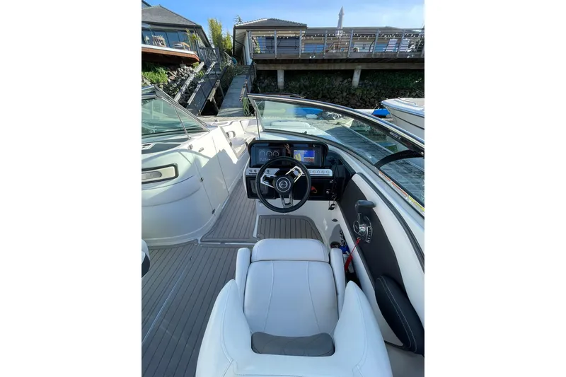 Slide: The Image of Control panel on 2022 Crownline 255 SS SURF boat, featuring sleek design and modern interface. - 25