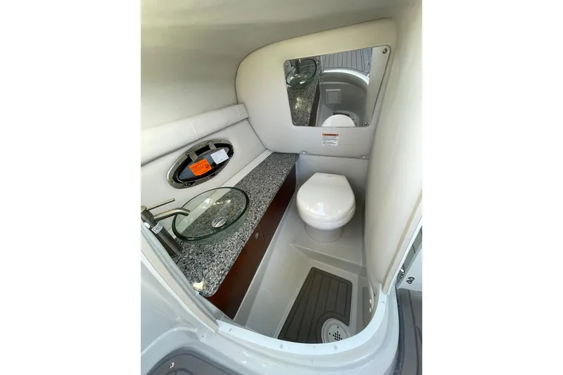 Slide: The Image of 2022 Crownline 255 SS SURF boat interior with illuminated blue light detail. - 32